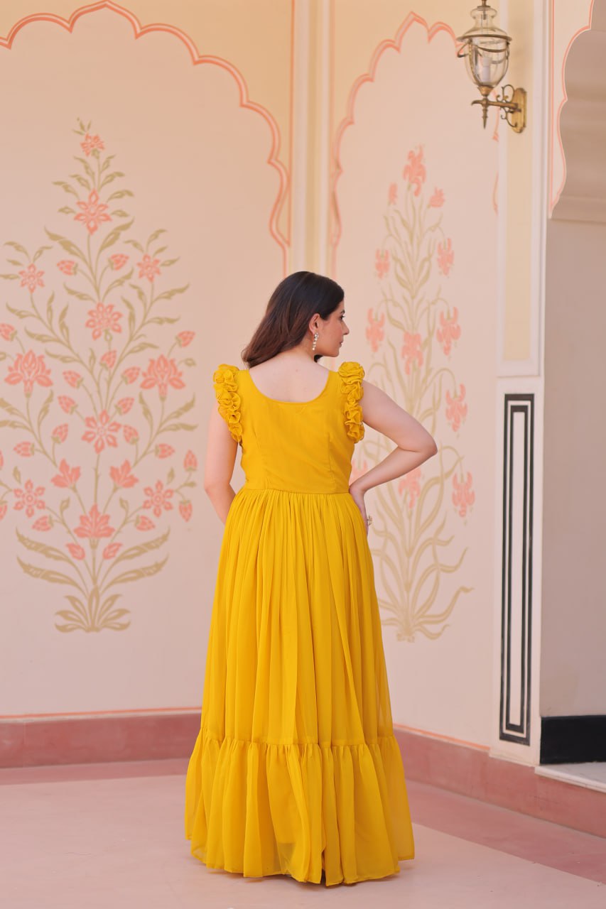 Lavi 7-meter flared designer gown in faux blooming fabric with sequin & bead embroidery, V-neck & frill shoulders – perfect for weddings & parties.